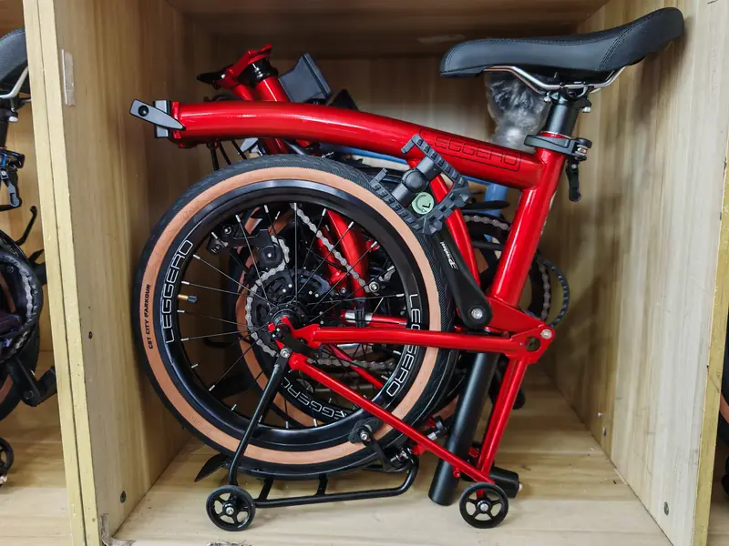 Red Leggero 16C-7S folded in a showroom cubby