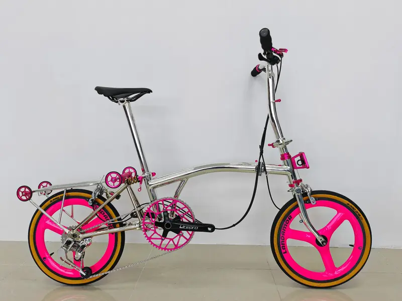 Chrome titanium 16-inch trifold with hot pink tri-spoke wheels