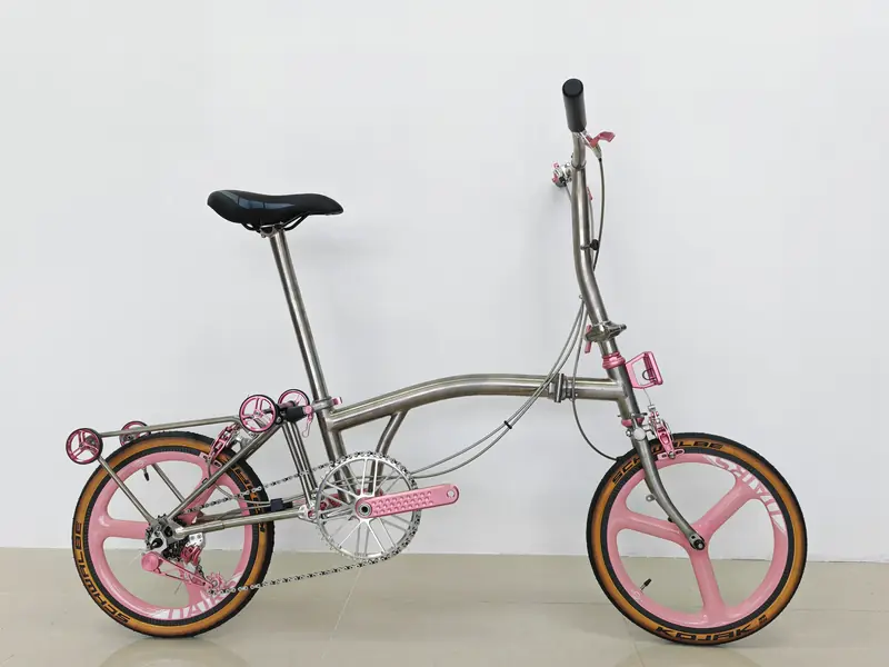 Raw titanium 16-inch trifold with pink Union Jack parts