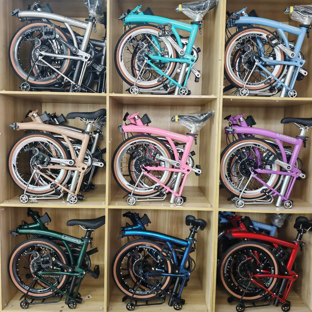 Nine folded Leggero 16C-7S bikes in wooden cubbies in nine colours